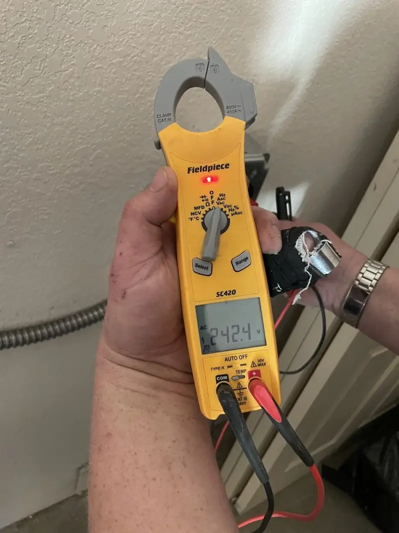 Voltage testing with clamp meter during Outlet Installation in Chattanooga